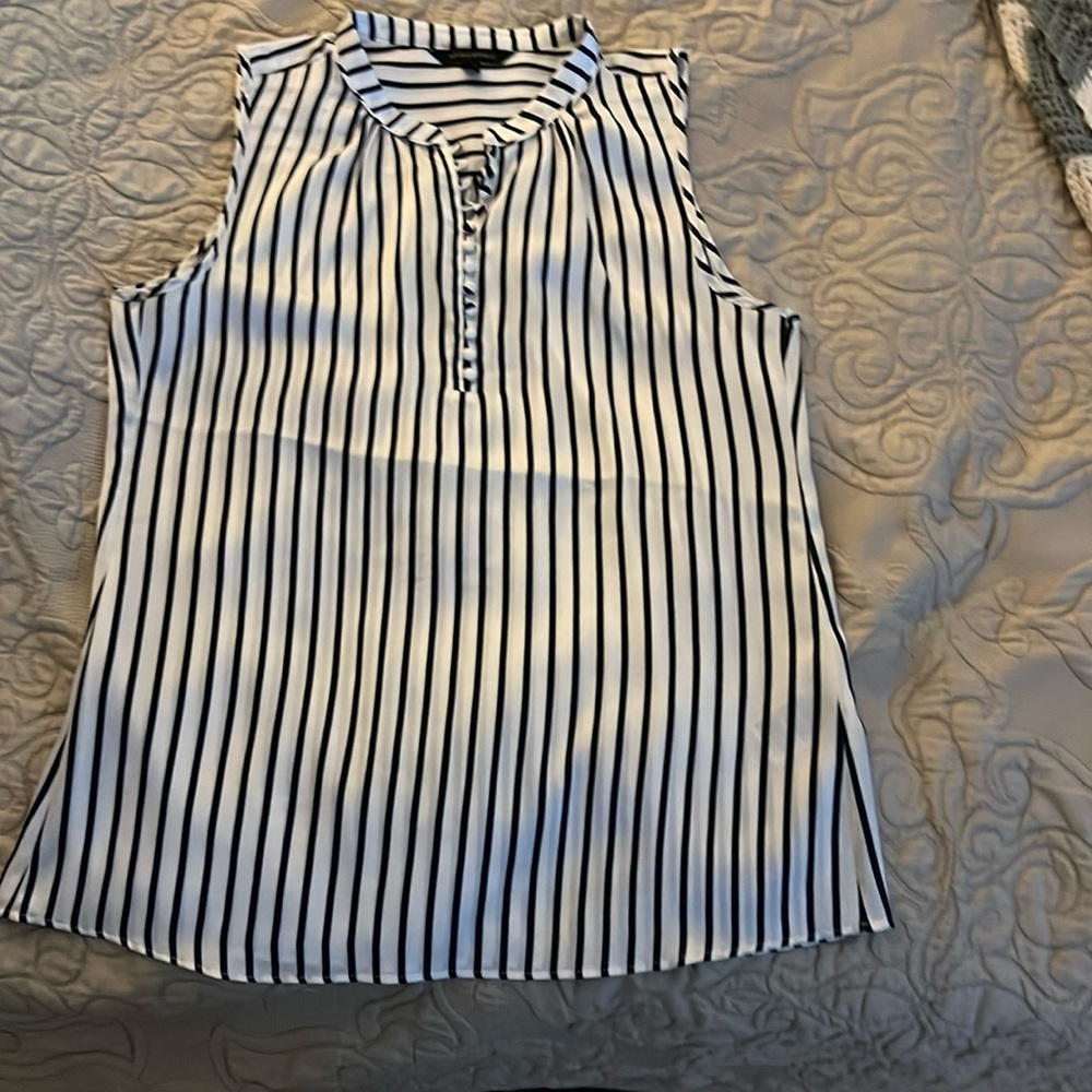 Sleeveless silk blouse. Non smoking home. Perfect condition.